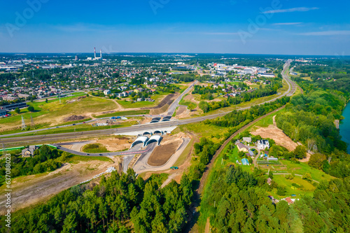 Construction of new city bypass and tunnels in Kaunas, Lithuania on the coast of Kaunas lagoon. Aerial drone view © Audrius