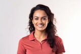 Medium shot portrait of an Indian woman in her 30s wearing a sporty polo shirt against a white background