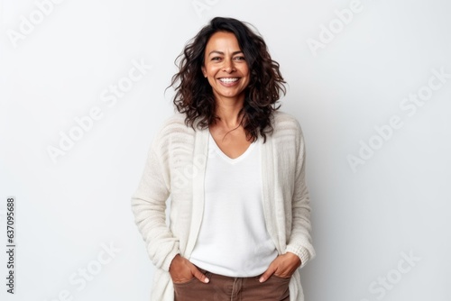 Medium shot portrait of an Indian woman in her 40s against a white background