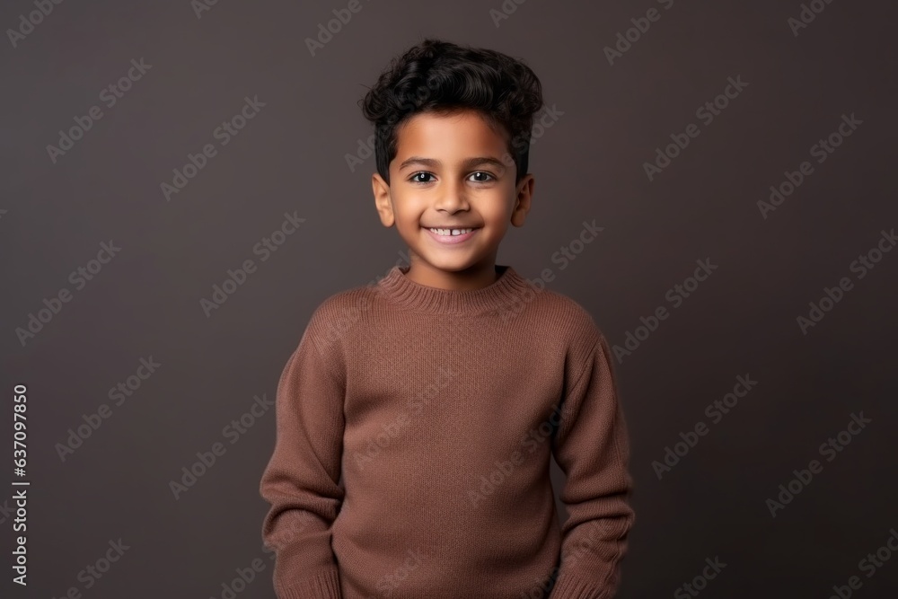 Medium shot portrait of an Indian child male in a minimalist background Medium shot portrait of an Indian child male in a minimalist background