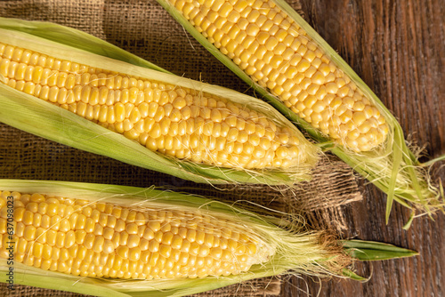 Corn on a brown wooden background