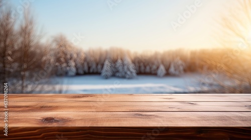 empty wooden table rustical style for product presentation with a blurred winter landscape in the background © HandmadePictures