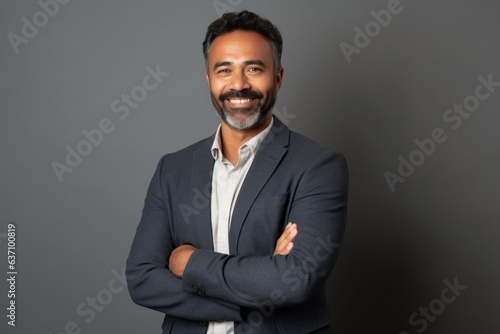 Obraz na płótnie Medium shot portrait of an Indian man in his 40s in a minimalist background w salonie