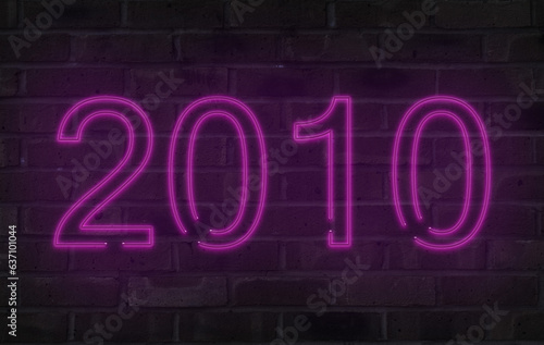 Purple 2010 neon sign on a brick wall