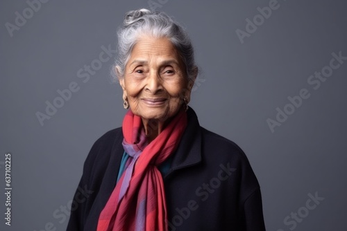 Medium shot portrait of an Indian woman in her 90s in a minimalist background