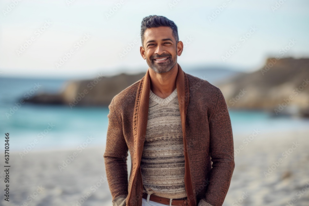 Lifestyle portrait of an Indian man in his 30s in a beach Lifestyle portrait of an Indian man in his 30s in a beach