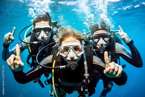 Stunning trio in scuba gear, pointing at ocean marvel off-frame, in deep blue aquatic backdrop, radiating awe and adventure. © XaMaps