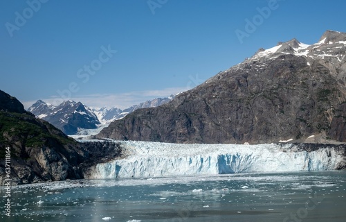 the glacier was falling off the side of the cliff to the side