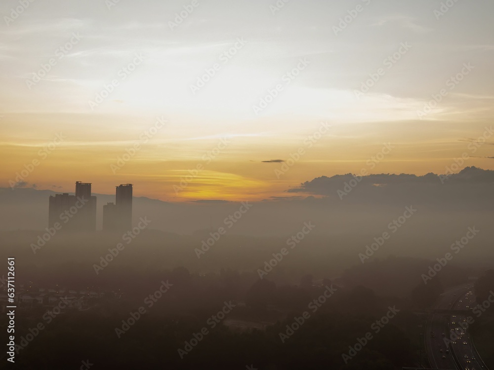 Scenic view of sunset over a bustling cityscape Scenic view of sunset over a bustling cityscape