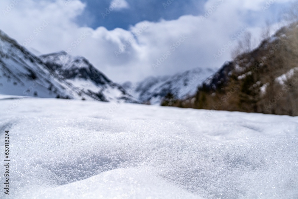 Closeup of a hill covered with snow in mountains in winter