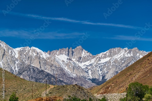 Scenic view of Whitney mountain range covered with snow on a sunny day