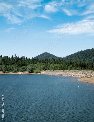 Scenic view of a tranquil lake surrounded by greenery in Fuzina, Croatia © Lucic Dragan/Wirestock Creators