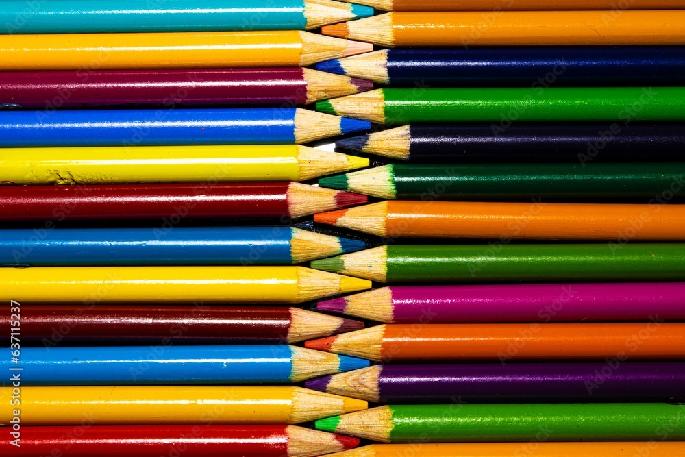 Color pencils against a black background. Color pencils against a black background.