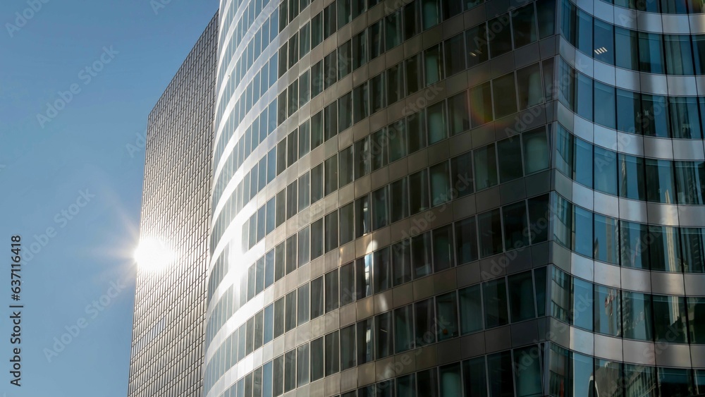 High-rise building illuminated by the bright sunlight High-rise building illuminated by the bright sunlight