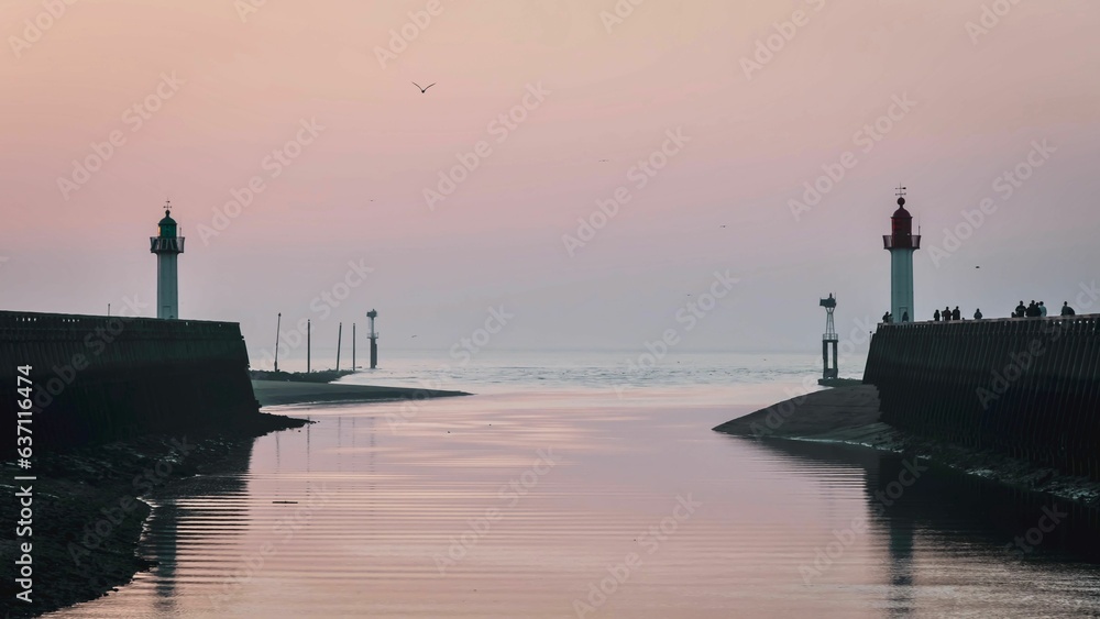 Lighthouses on the beach at sunset in Deauville, France