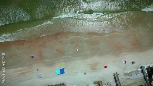 Upward view of Wilbur beach, with Daytona beach and Ponce inlet in the background, sunny beach day photo