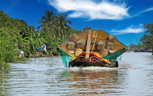 Fotografie Beautiful Mekong Delta landscape, one traditional typical vietnamese sampan rice