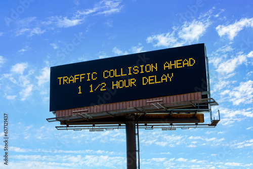Electronic highway billboard with traffic collision delay warning