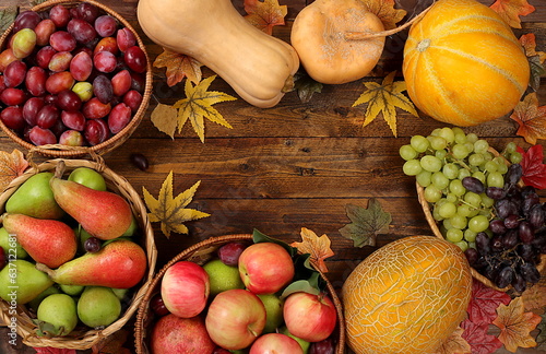 Fototapeta Naklejka Na Ścianę i Meble -  Autumn background with apples, pears, pumpkins, melons and plums in baskets on a wooden table, Happy Thanksgiving concept, rustic harvest, healthy natural food concept, screen banner, cafe,
