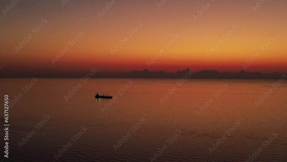 Sunset orange sky and ship background. After sunset sky. Sun set 4K background. Sunset orange sky and ship background. After sunset sky. Sun set 4K background.