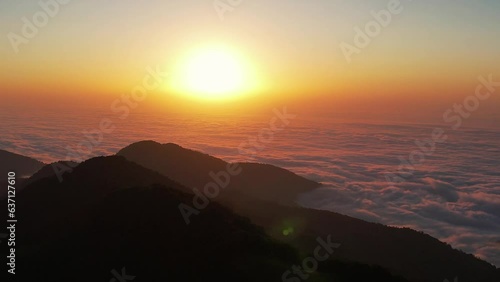 Wallpaper Mural Setting sun goes into the clouds. Sun set over the clouds. Orange sun closeup 4K. Torontodigital.ca