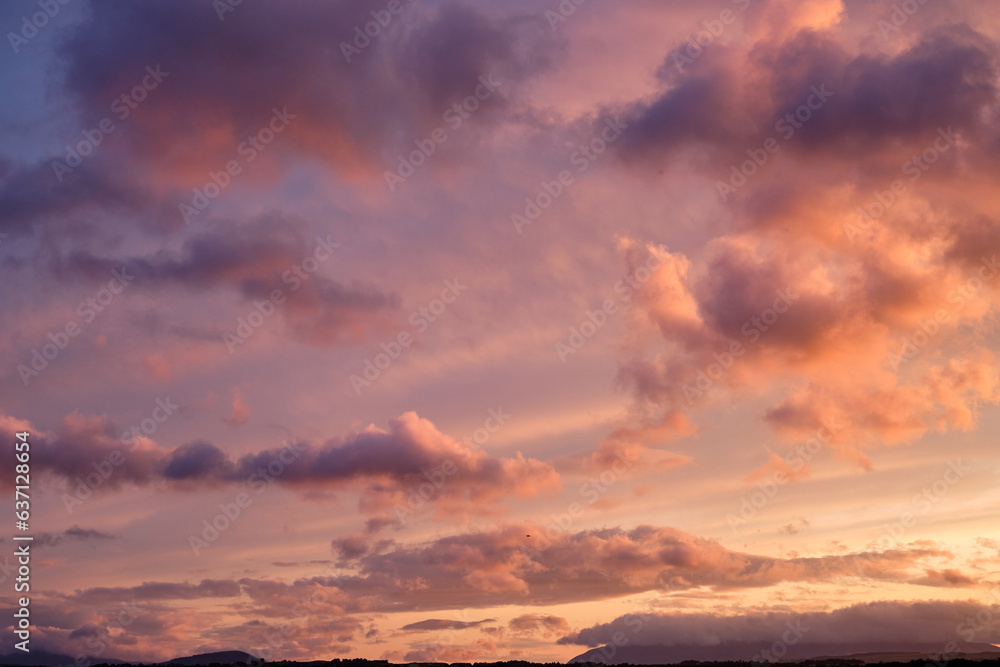 Fototapeta premium Cloudscape dramatic background, sunset light