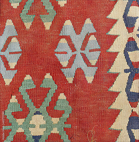 Turkish kilim with orange and brown, red patterns photo