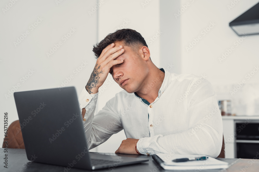 Stressed tired man in pain having strong terrible headache attack after computer laptop work, fatigued exhausted guy suffering from chronic migraine massaging temples to relieve head ache tension. Stressed tired man in pain having strong terrible headache attack after computer laptop work, fatigued exhausted guy suffering from chronic migraine massaging temples to relieve head ache tension.