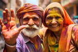 elderly happy couple all in colorful colors during holi festival of colors
