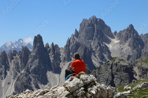 Hiker enjoying the view in Dolomites 