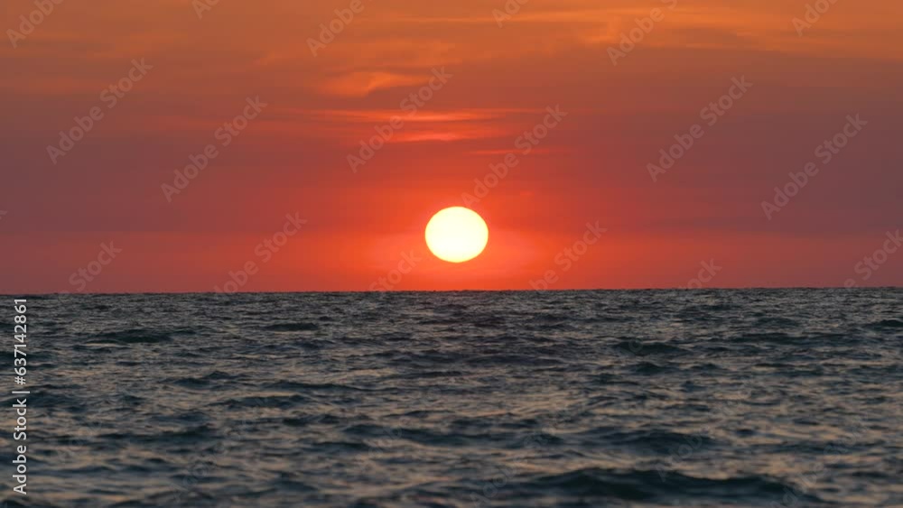 Big yellow sun on dramatic bright sky. Ocean sunset. Soft evening horizont over sea dark water Big yellow sun on dramatic bright sky. Ocean sunset. Soft evening horizont over sea dark water