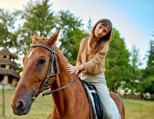 A woman gently stroking a horse on a grassy field amidst rural landscapes. A portrait of a young jockey highlights farm training and an outdoor saddle sports setup. Equestrianism, horse riding © Sundaylights