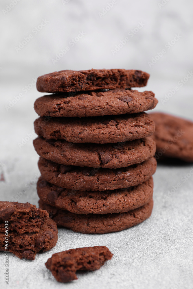 Tasty chocolate cookies on light grey table, closeup Tasty chocolate cookies on light grey table, closeup