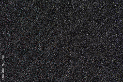 Black soft foam board background. black sponge surface texture. photo