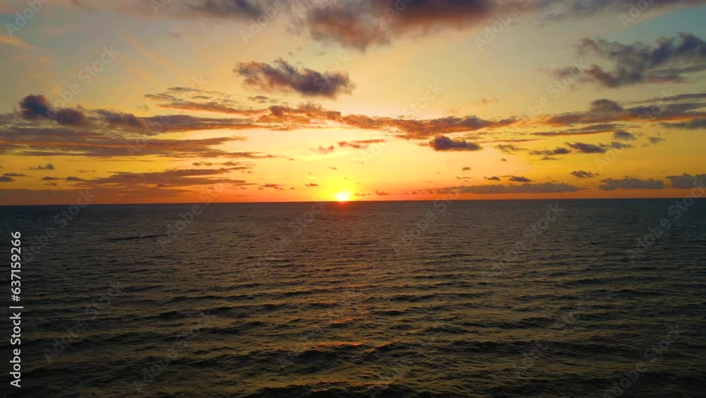 Aerial view of sunset horizon over the sea. Cinematic drone aerial view beautiful evening sunset in sky over sea. Sun path is reflected in sea surface. Nature beauty. Aerial view of sunset horizon over the sea. Cinematic drone aerial view beautiful evening sunset in sky over sea. Sun path is reflected in sea surface. Nature beauty.