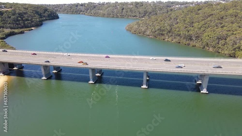 Aerial drone view of Alfords Point Bridge across Georges River between Padstow Heights in the City of Bankstown and Alfords Point in the Sutherland Shire in Sydney, New South Wales, Australia  photo