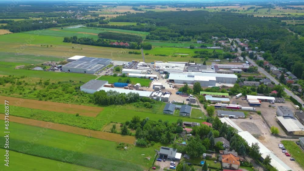 Aerial view of goods warehouse. Logistics center in industrial city zone from above. Aerial view of trucks loading at logistic center Aerial view of goods warehouse. Logistics center in industrial city zone from above. Aerial view of trucks loading at logistic center