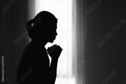 silhouette of Religious young woman praying to God in the morning, spirtuality and religion, Religious concepts