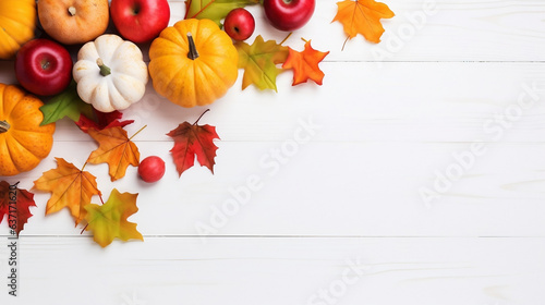 Halloween  Thanksgiving concept  Apples  pumpkins  fallen leaves on a white wooden background  copy space  design banner for websites and blogs  flat lay autumn fall concept