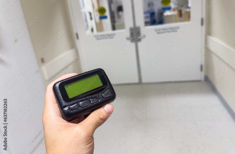 Pager's presence signifies instant connection: modern communication's emblem, bridging distances, conveying urgency, and shaping era-defining connections Pager's presence signifies instant connection: modern communication's emblem, bridging distances, conveying urgency, and shaping era-defining connections