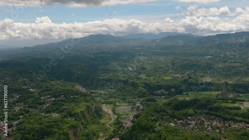 Aerial drone of canyon and valley with rainforest and Mount Singgalang. Ngarai Sianok. Bukittinggi, Sumatra, Indonesia. photo