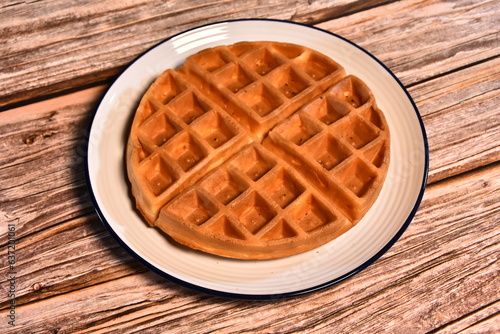 Waffle and wooden blackground