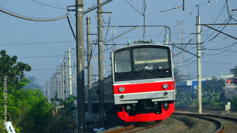 The train is running on the rails towards the destination The train is running on the rails towards the destination