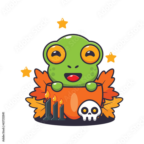 Cute frog in halloween pumpkin.
