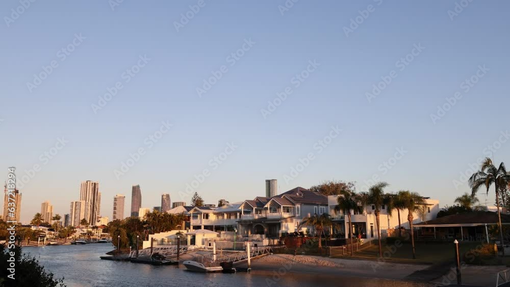 Time lapse of a sunset over Broadbeach, QLD, Australia, with a view of residential houses and tall buildings in the background. Time lapse of a sunset over Broadbeach, QLD, Australia, with a view of residential houses and tall buildings in the background.