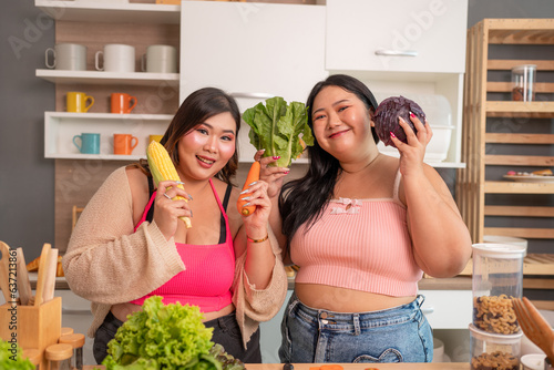 group of fat asian women learn how to cook healthy meals and prepare a vegetable salad for diet food and lose weight. Concept of healthy eating.