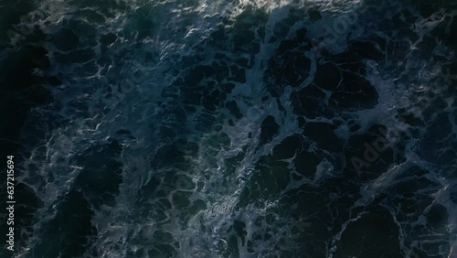 A top-down view of choppy Atlantic waters and big waves . Dramatic background shot for titles