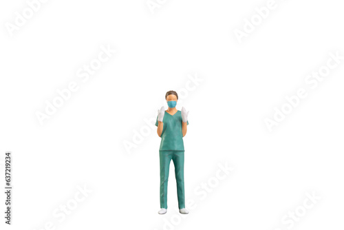 Miniature people young doctor in scrubs Isolated on white background with clipping path © Sirichai Puangsuwan