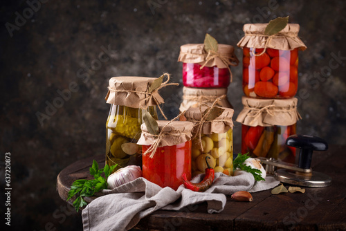 Pickled vegetables in glass jars.