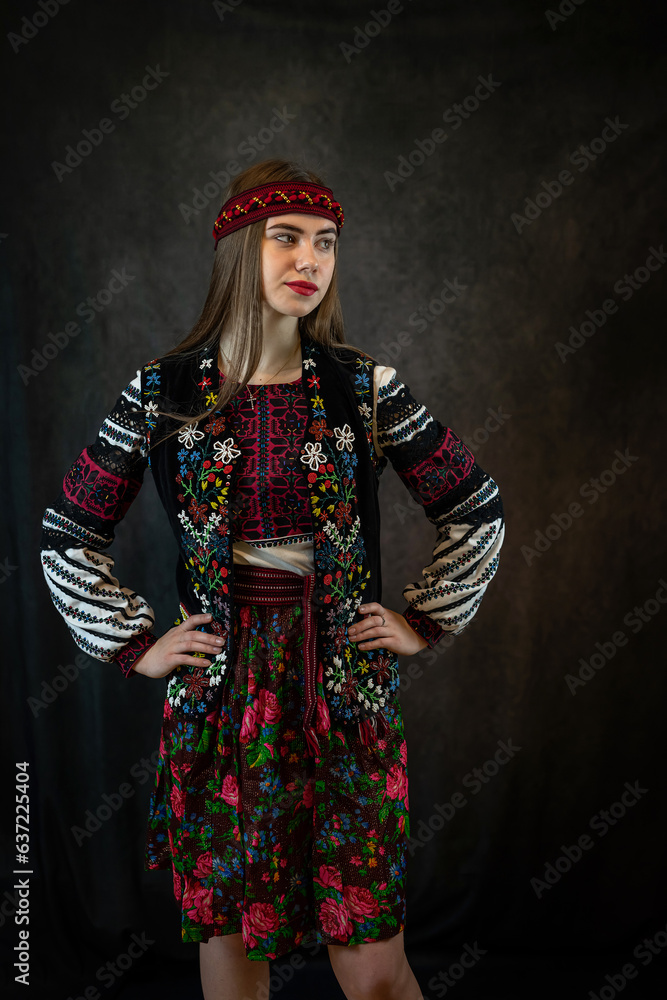 Portrait of beautiful caucasian ukrainian young woman wear red embroidered dress, vyshyvanka Portrait of beautiful caucasian ukrainian young woman wear red embroidered dress, vyshyvanka